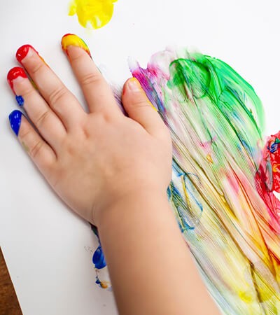 child finger painting