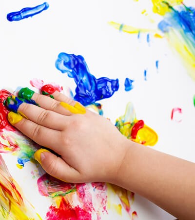 child finger painting